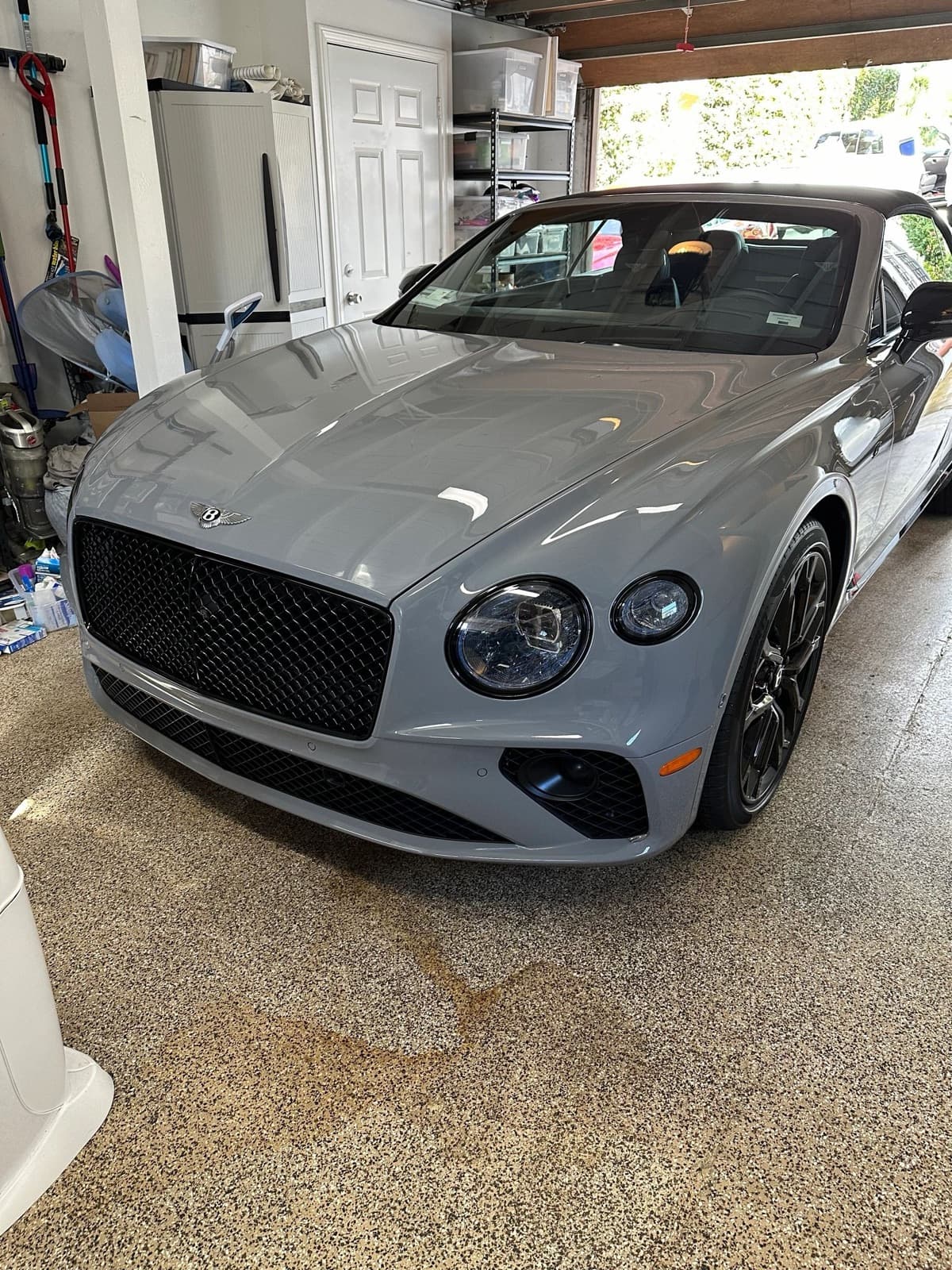 Gray Bentley Continental GT in a garage after a full detail