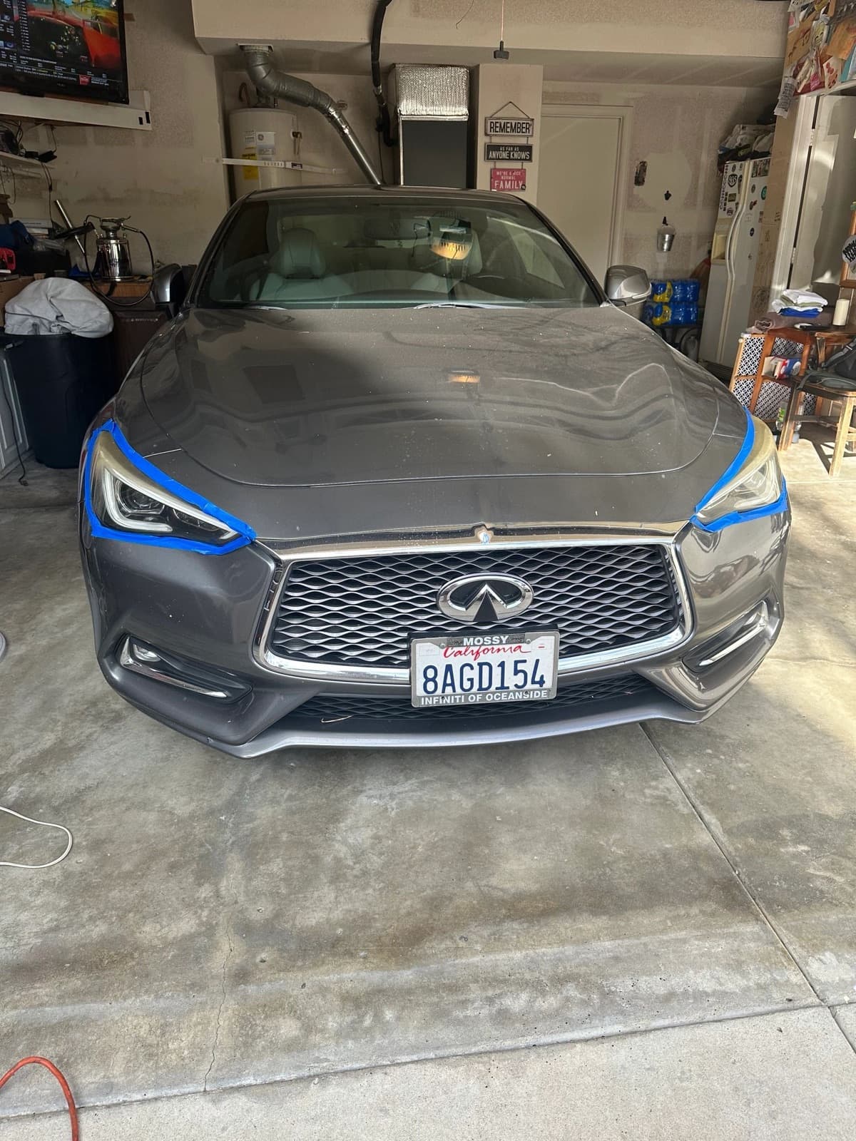 Gray Infiniti Q60 front end and headlights
