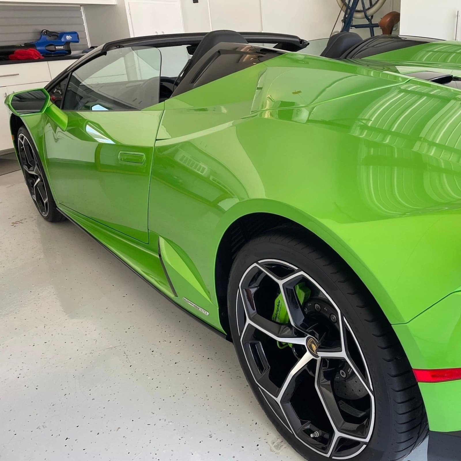 Green Lamborghini Huracán convertible with a glossy finish